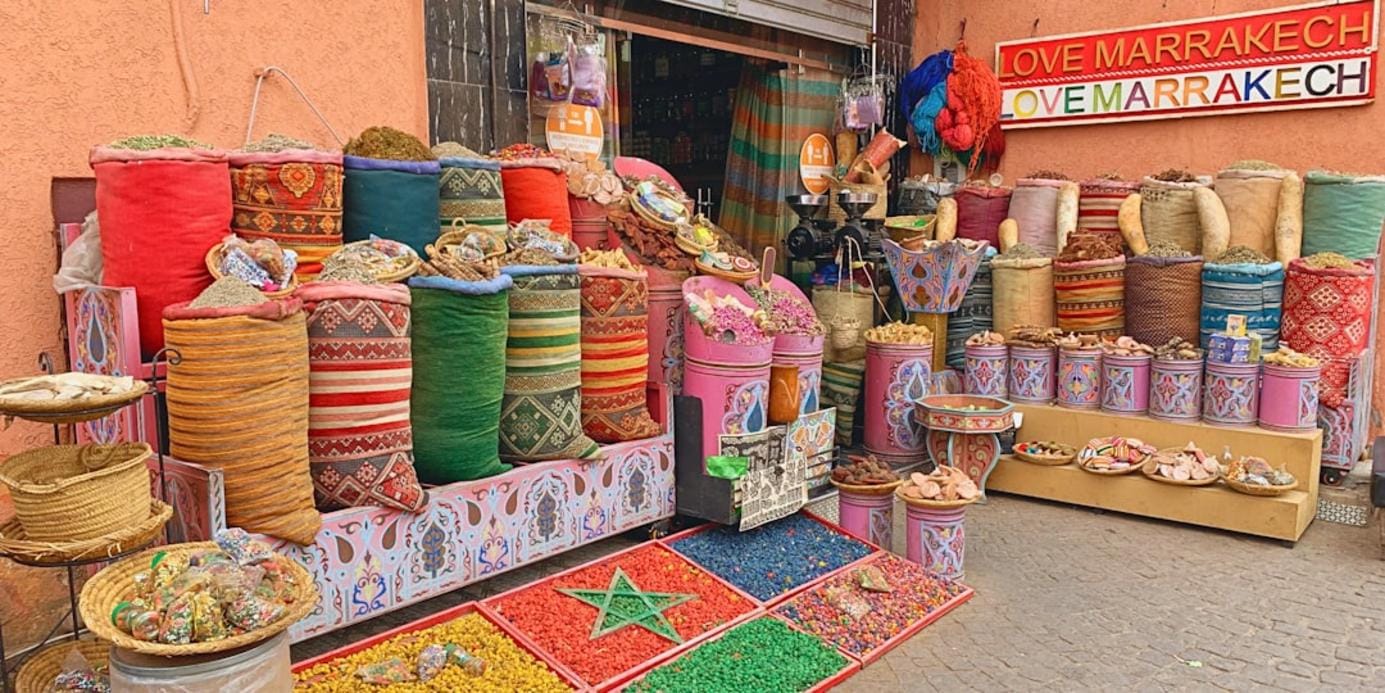 A vibrant Turkish bazaar in Antalya with colorful textiles, spices, and handcrafted souvenirs